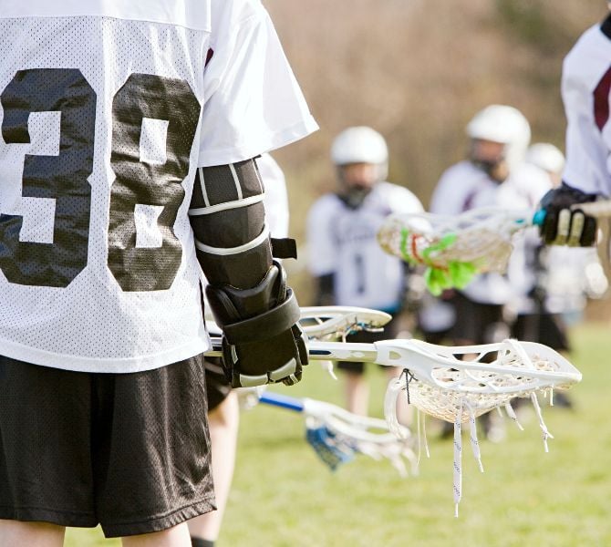 Lacrosse players preparing for a match