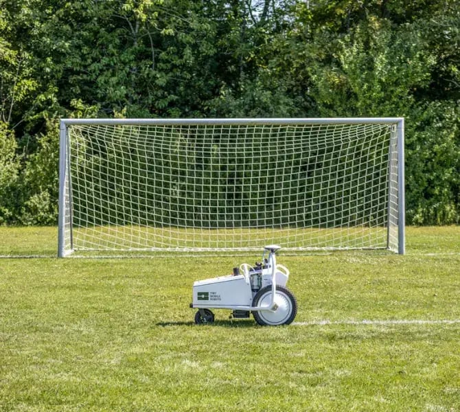 tinylinemarker pro x in front of a football goal